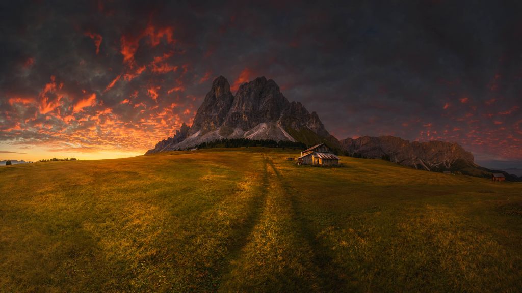 Sunset by a mountain
