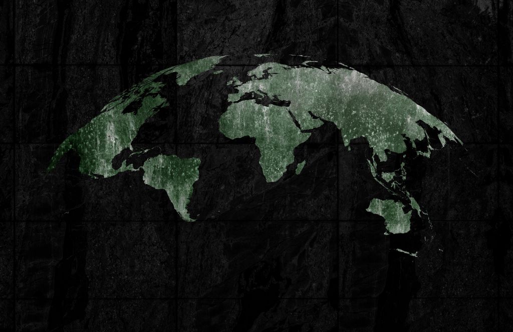 Carte du monde verte sur du béton